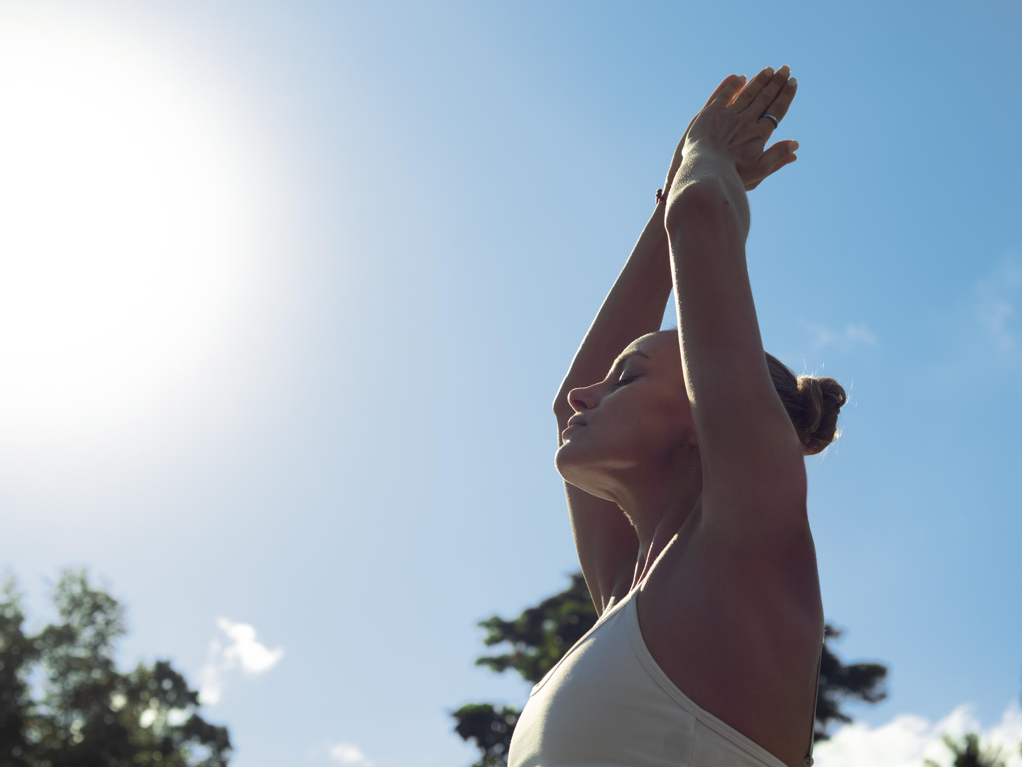 Adiwana Suweta Hotel Ubud Eksteriør billede A woman practicing yoga